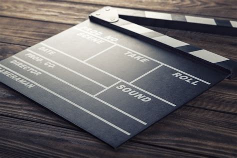 Premium Photo Clap Board On Wooden Background