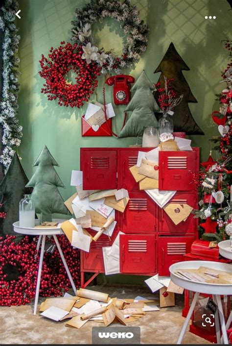 Red Lockers And Christmas Wreaths Are On Display In A Room With Green Walls