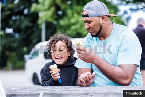 Father And Son Eating Ice Cream By Kathryn Taylor Truestock