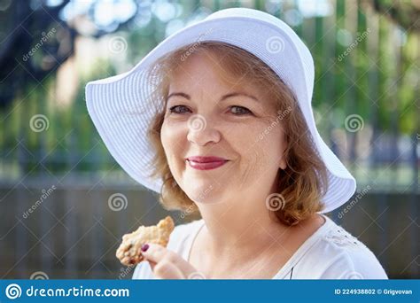 Mature Attractive Woman In Hat Is Posing Outdoor Middle Aged Caucasian