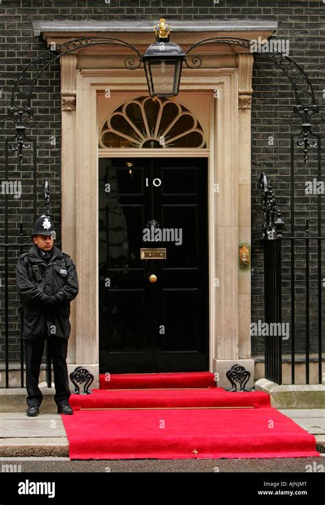 A Policeman On Duty Outside The Door Of Number 10 Downing Street The Home Of The British Prime