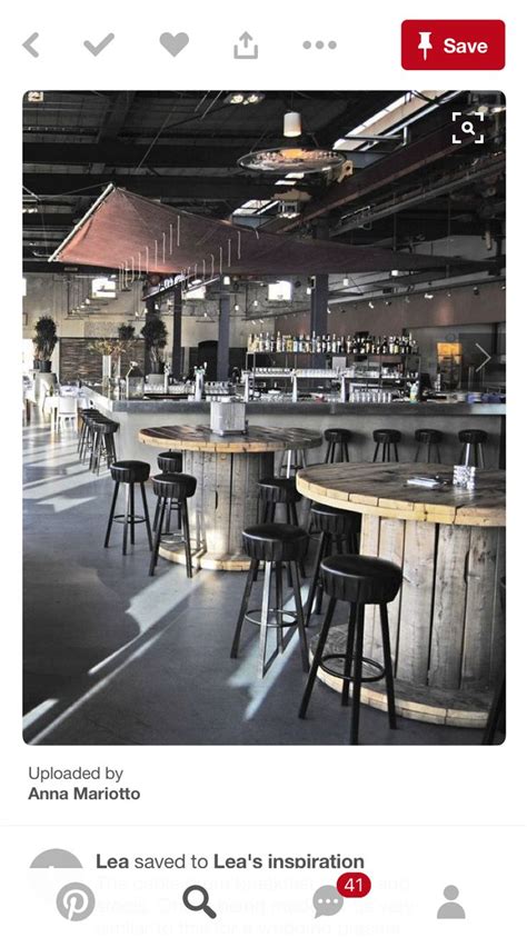 An Empty Bar With Several Stools And Barstools In The Middle Of It