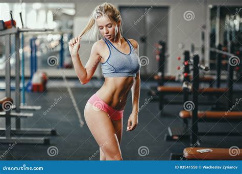 Fitness Happy Blonde Girl In Sport Wear With Perfect Body In The Gym Posing And Smiling Stock