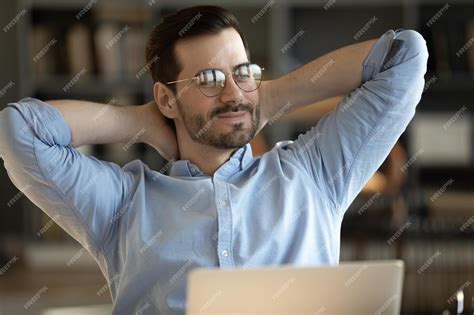 Premium Photo Happy Calm Young Caucasian Male Worker In Glasses Relax