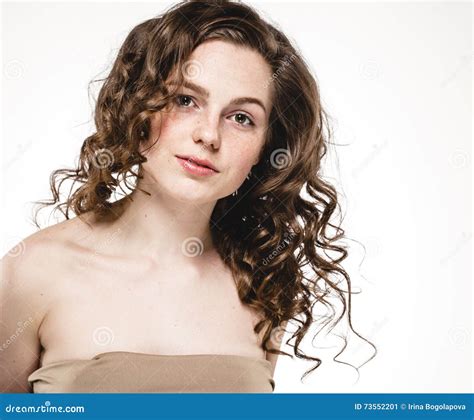 Beautiful Woman Face With Curly Flying Hair Studio On White Stock Image