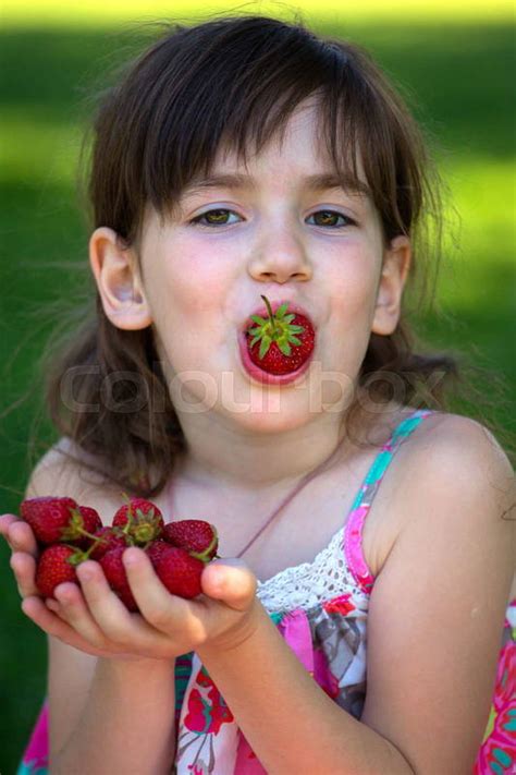 Summer Portrait Of A Smiling Girl With A Strawberry In Han Colourbox