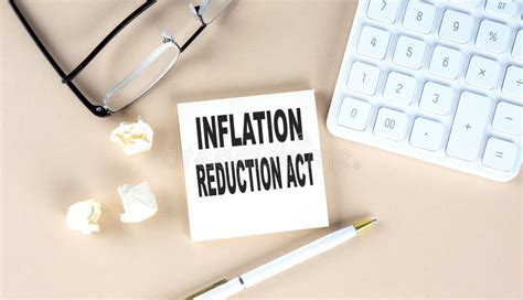 Inflation Reduction Act Text On Sticky With Pen Calculator And Glasses