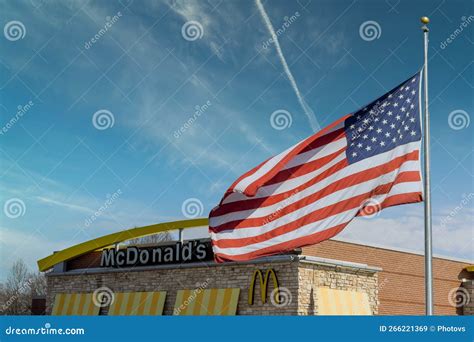 Exterior View Of Contemporary Mcdonalds And Us Flag Editorial Stock