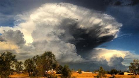 Apocalyptical anvil cloud at sunset swallows up Chinchilla, Australia ...