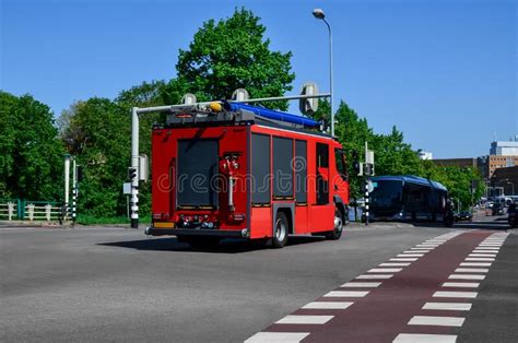 Modern Red Fire Truck On City Street Stock Photo Image Of Danger