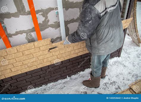 Installing Brick Siding on the Wall of the House Stock Photo - Image of ...