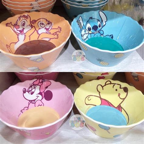 Four Different Bowls With Cartoon Characters Painted On The Sides And