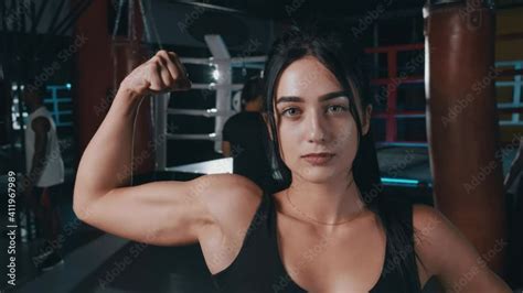 Vidéo Stock Attractive Strong Female Athlete Looking Positive At Camera