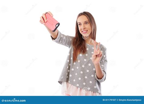 Portrait Of A Young Attractive Woman Making Selfie Photo On Smartphone Isolated On A White