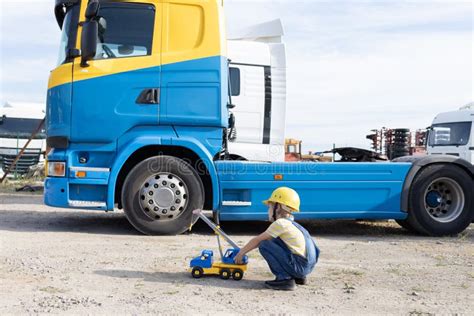 Construction Dump Truck Performs Earthwork At A Construction Site Stock