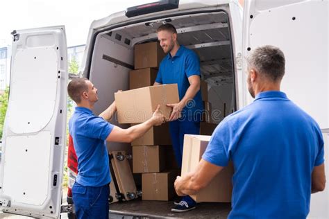 Two Movers Loading Boxes in Truck Stock Photo - Image of relocation, profession: 56852386