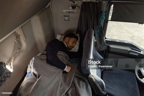 Truck Driver Sleeping In Cabin Bed On Truck Stop Stock Photo Download