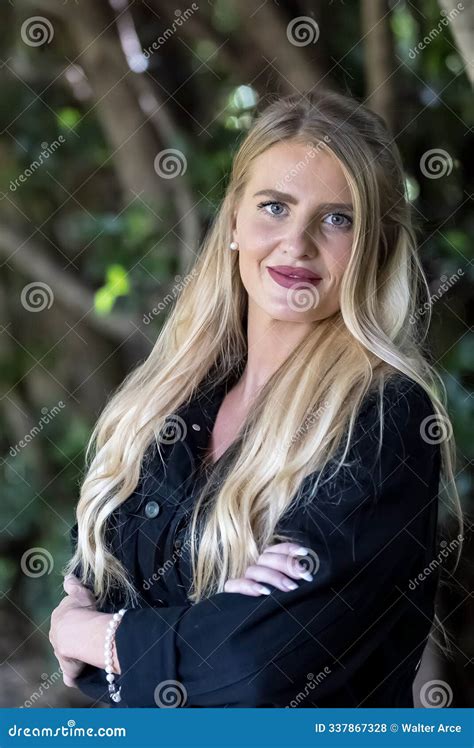 Blonde Beauty Glows In Autumn Sunlight Capturing A Perfect Moment Of Serenity And Radiance