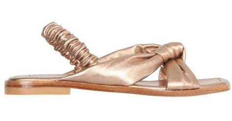 Stuart Weitzman Playa Knot Flat Sandals In Metallic Lyst