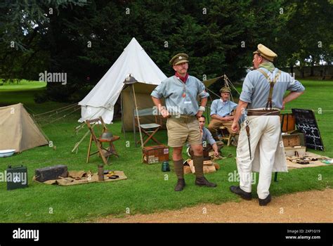 Four Men In First World War Uniforms In Front Of Tents Stock Photo Alamy