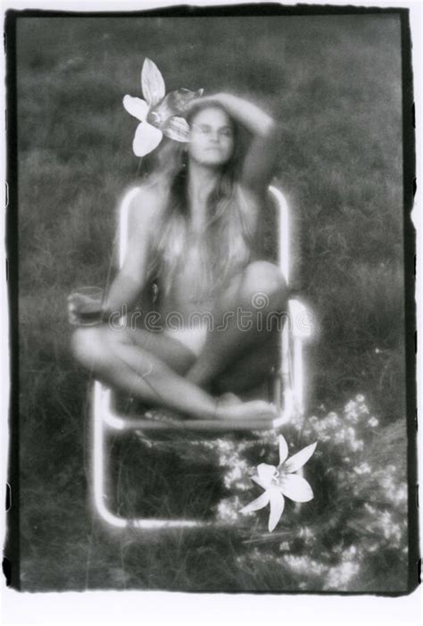 A Beautiful Naked Girl In A Wreath Holds A Glass In Her Hand Stock