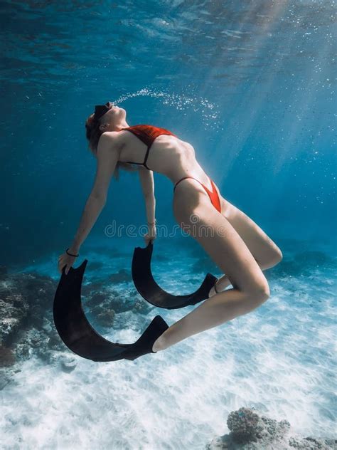 Woman Posing Underwater In Transparent Blue Ocean Freediver Girl Pose