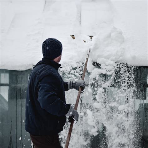 How To Safely Remove Snow From Your Roof Mccoy Roofing