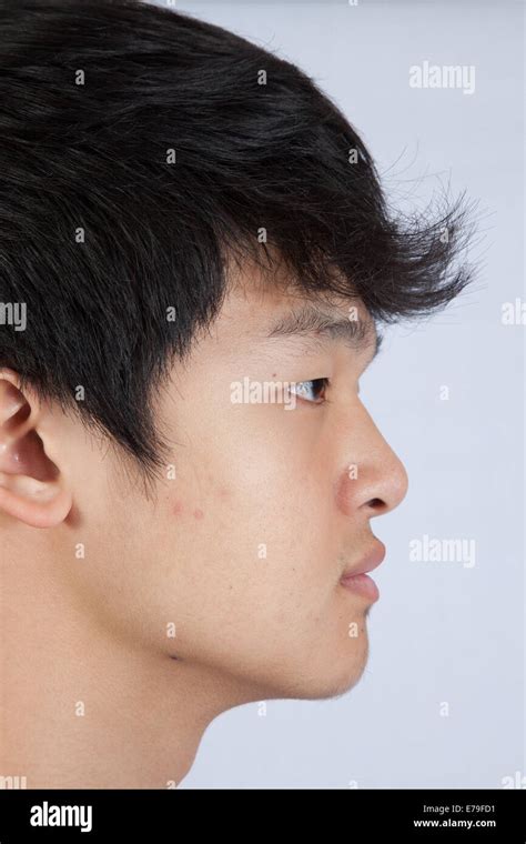 Handsome East Asian Man Looking Thoughtful Stock Photo Alamy