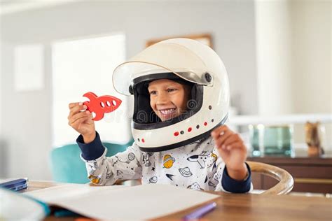 Child Playing With Astronaut Helmet And Rocket Stock Image Image Of