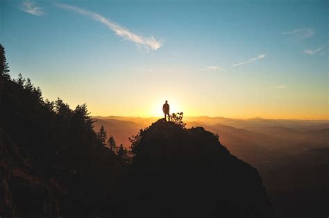 HD Wallpaper Silhouette Photo Of Man On Cliff During Sunset