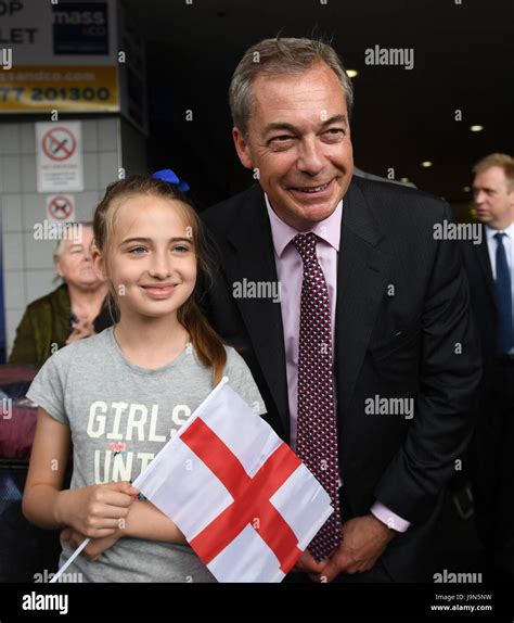 Former Ukip Leader Nigel Farage Poses For A Photograph With A Member Of