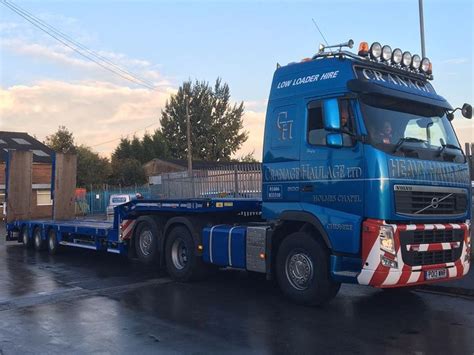 A Blue Semi Truck Is Parked On The Street