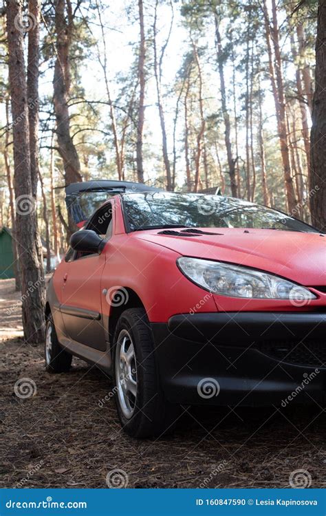 Picnic Car Parked In A Clearing In The Mountains On The Green Grass