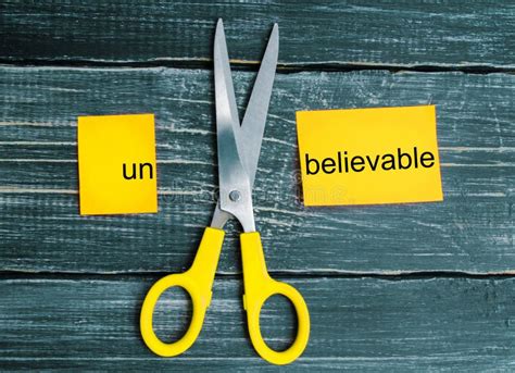 Scissors Cut The Word Unbelievable Concept Believable Stock Image