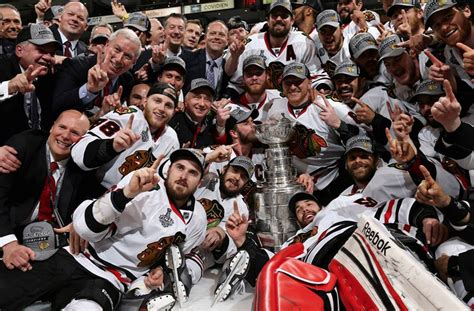 Jonathan Toews Kisses Stanley Cup During Team Championship Photo ...