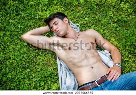 Shirtless Fit Male Model Relaxing Lying Foto Stock 2074566565