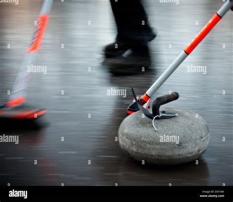 Traditional Scottish Sport Of Curling Being Held Outside On The Glen