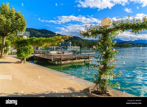 Promenade With Flowers Along Worthersee Lake On Beautiful Summer Day