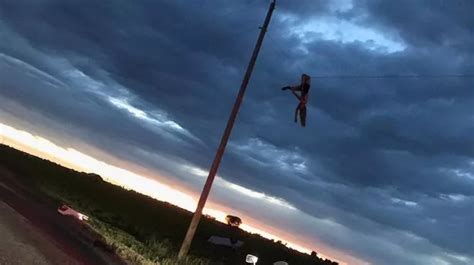 Teenager Seen Dangling From A Power Line After Being Thrown From Car In