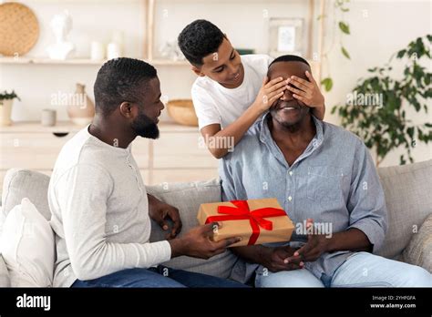 Grandfather S Birthday Mature Black Man And His Son Congratulating Grandad Stock Photo Alamy