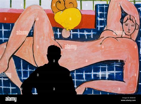 Man Studying Poster Of Pink Nude Henri Matisse Stock Photo Alamy