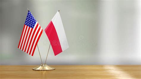 American and Polish Flag Pair on a Desk Over Defocused Background Stock ...