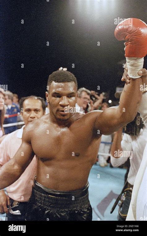 Wbc Heavyweight Champion Mike Tyson Raises His Fist In The Air After