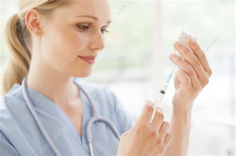 Doctor Preparing Injection Stock Image F008 3093 Science Photo