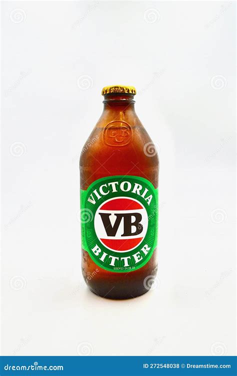 A Closeup Of A Stubby Of Victoria Bitter Against A White Background