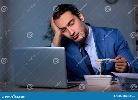 Hungry Employee Working Late In The Office Stock Photo Image Of Boss