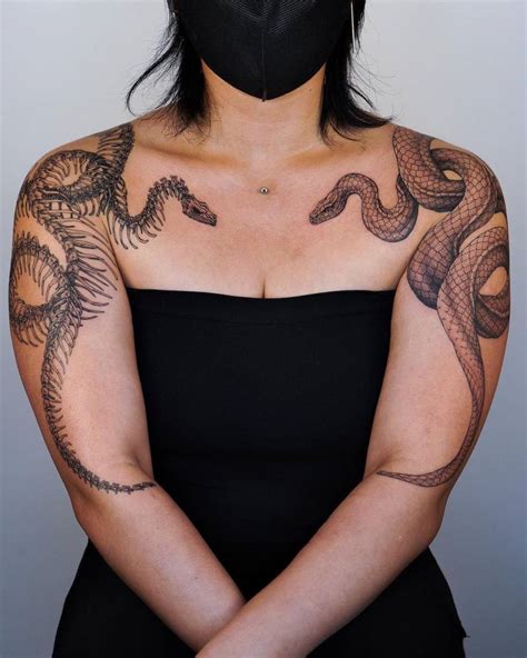 Snake And Skeleton Snake Tattoos Located On The