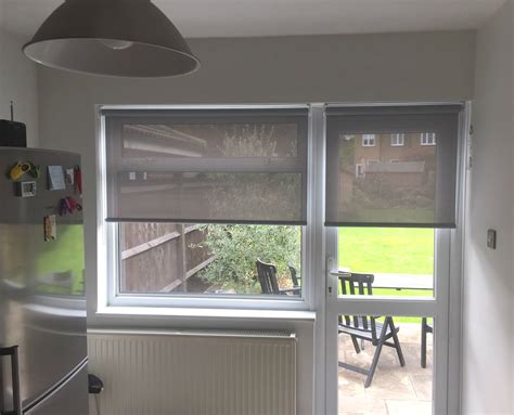 Sunscreen roller blinds on door and window in kitchen | Surrey | Made ...