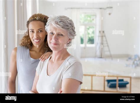 Two Women Smiling Together Stock Photo Alamy