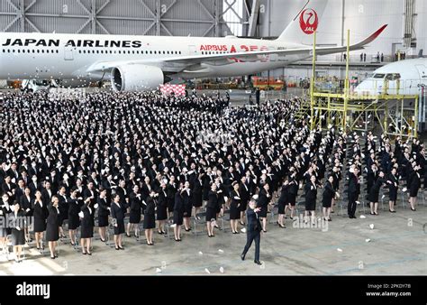 Jal President Yuji Akasaka With New Employees Flying Paper Airplanes At